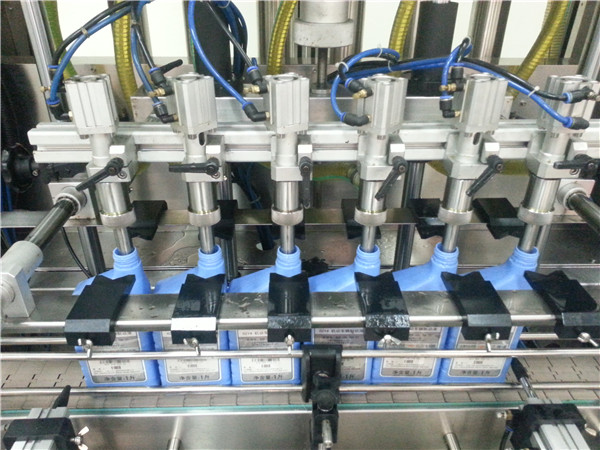 Machine de remplissage d'huile à moteur automatique à 6 têtes